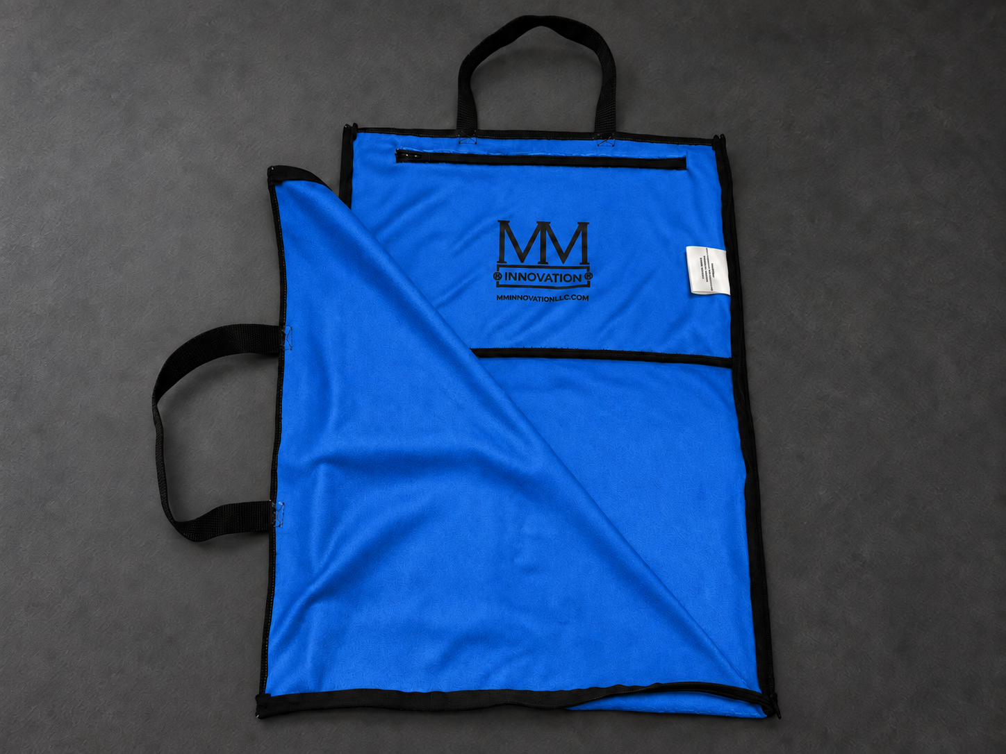 Illustrative blue opened towel retaining MM Innovation interior branding