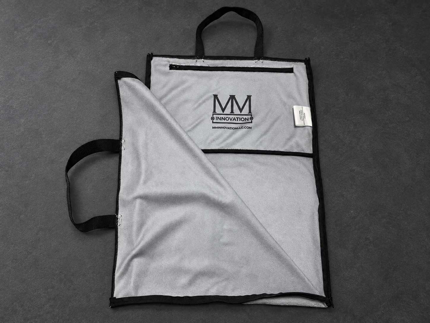 Original gray opened towel with MM Innovation interior branding